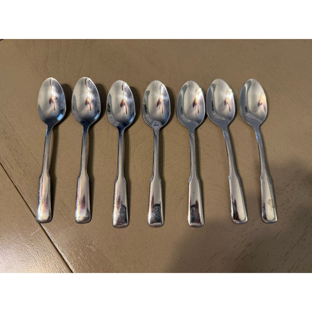 Oneida set of 7 stainless dinner spoons
